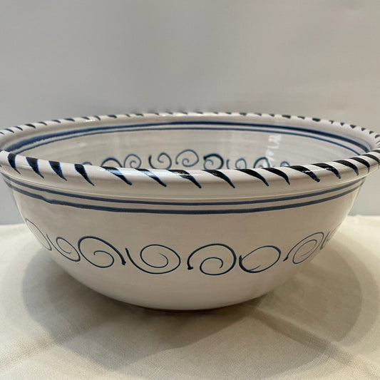 Ceramic bowl with blue decorative patterns on a light background