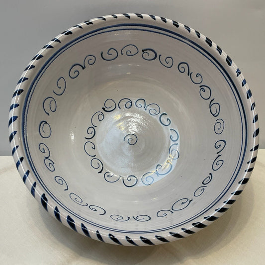 Ceramic bowl with blue decorative patterns on a white background