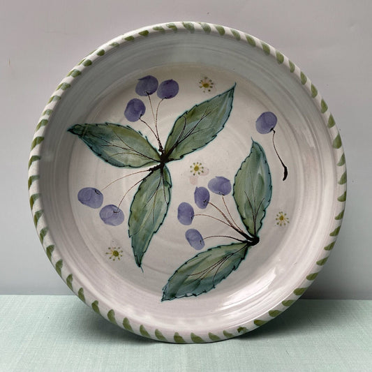 Ceramic plate with floral design on a white background